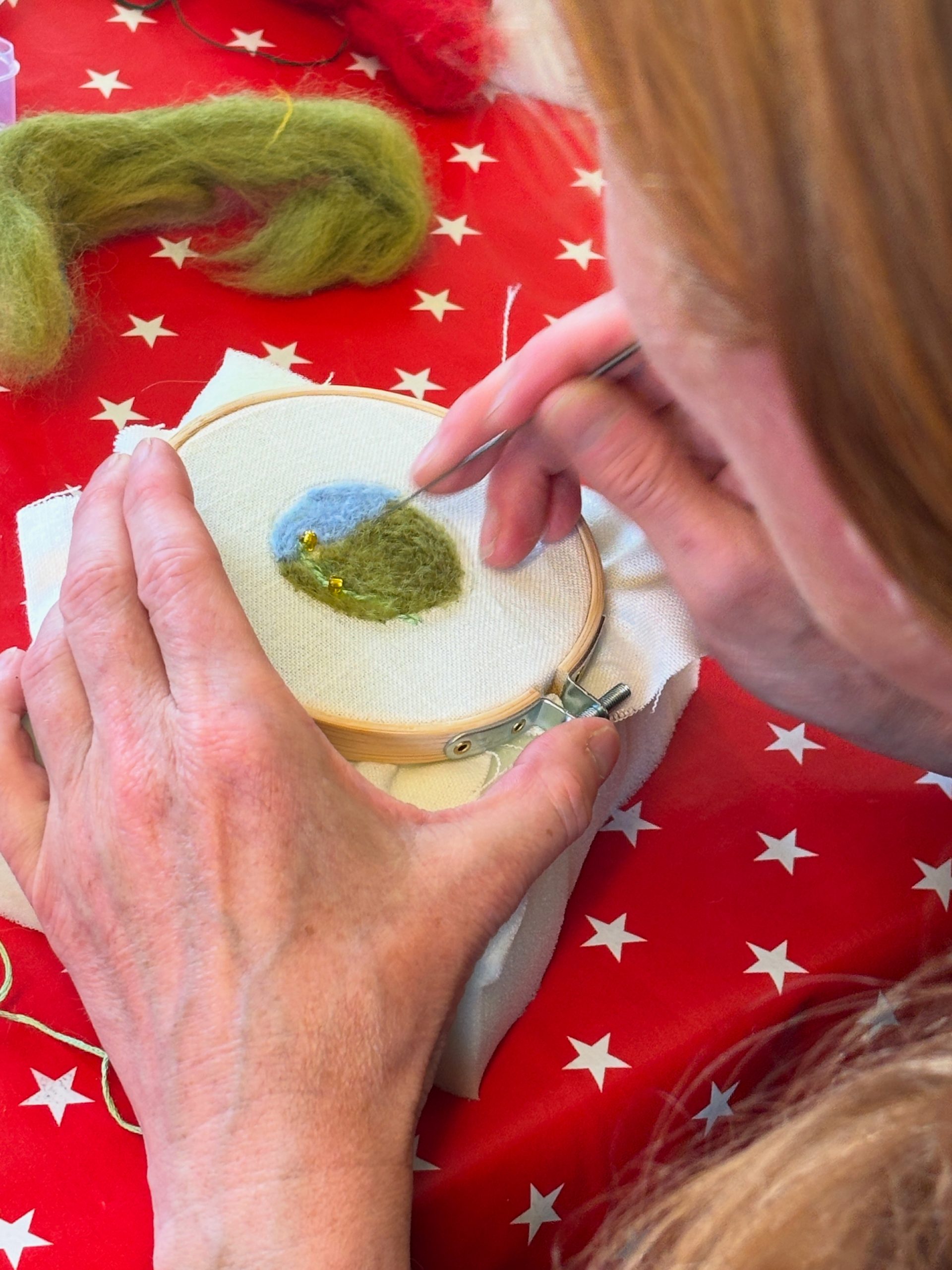 Close up of workshop participant trying needle felting
